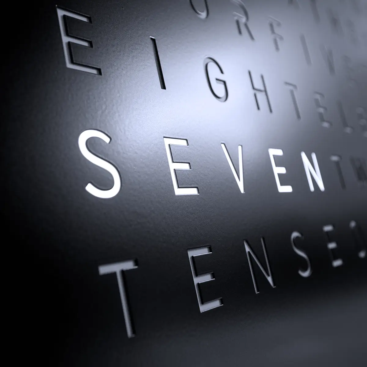 Close-up of QLOCKTWO EARTH 45 Black Pepper matte textured front cover