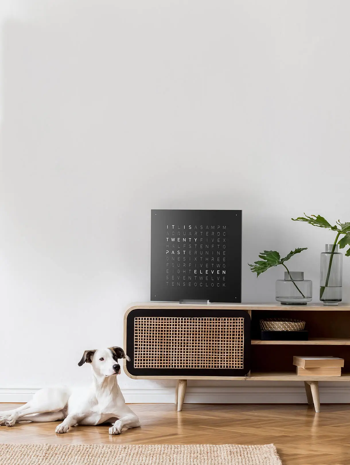 QLOCKTWO EARTH 45 Black Pepper word clock with black finish displayed in a modern living room