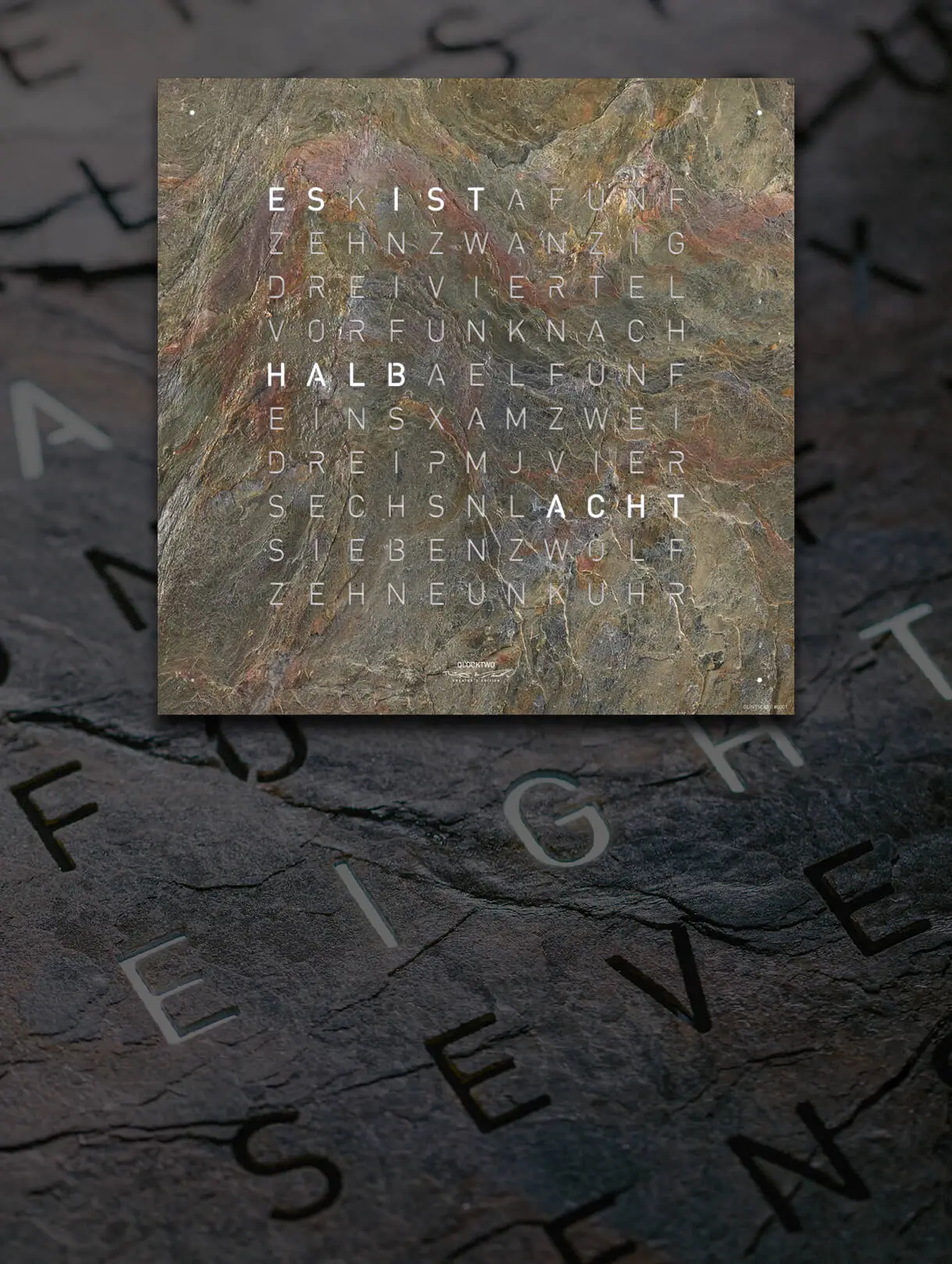 Front view of the QLOCKTWO EARTH 45 CREATOR'S EDITION GLINTSCAPE word clocks for the wall with sedimentary stone front cover