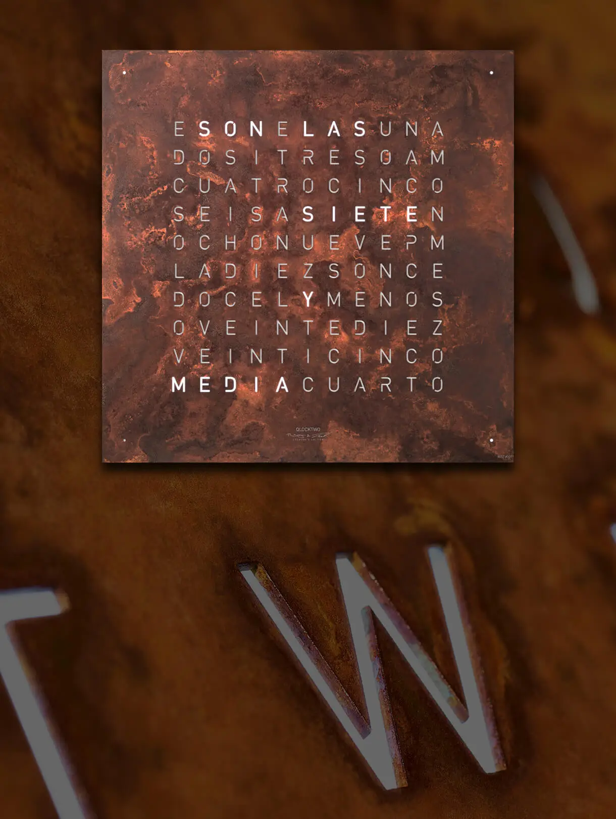 Front view of the QLOCKTWO EARTH 45 CREATOR'S EDITION RUST word clocks for the wall with rust front cover
