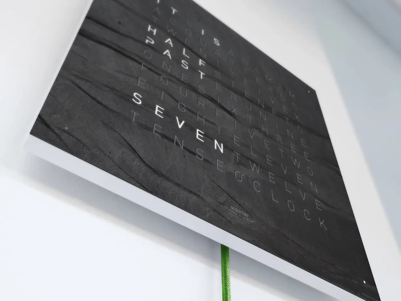 QLOCKTWO EARTH 45 Creator's Edition Metamorphite word clock with natural slate stone surface in an elegant interior