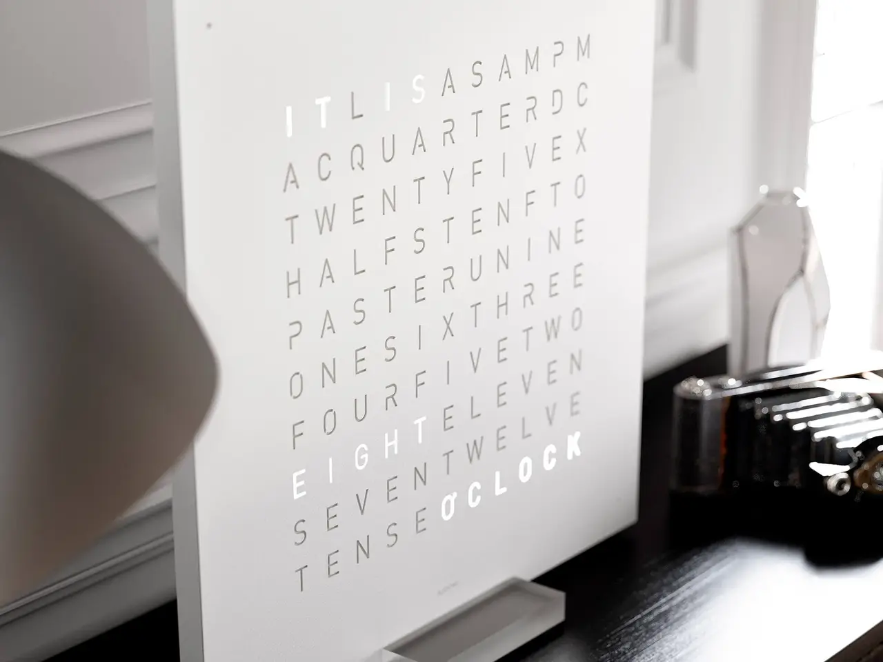 QLOCKTWO EARTH 45 White Pepper word clock with white textured surface mounted in a bright interior