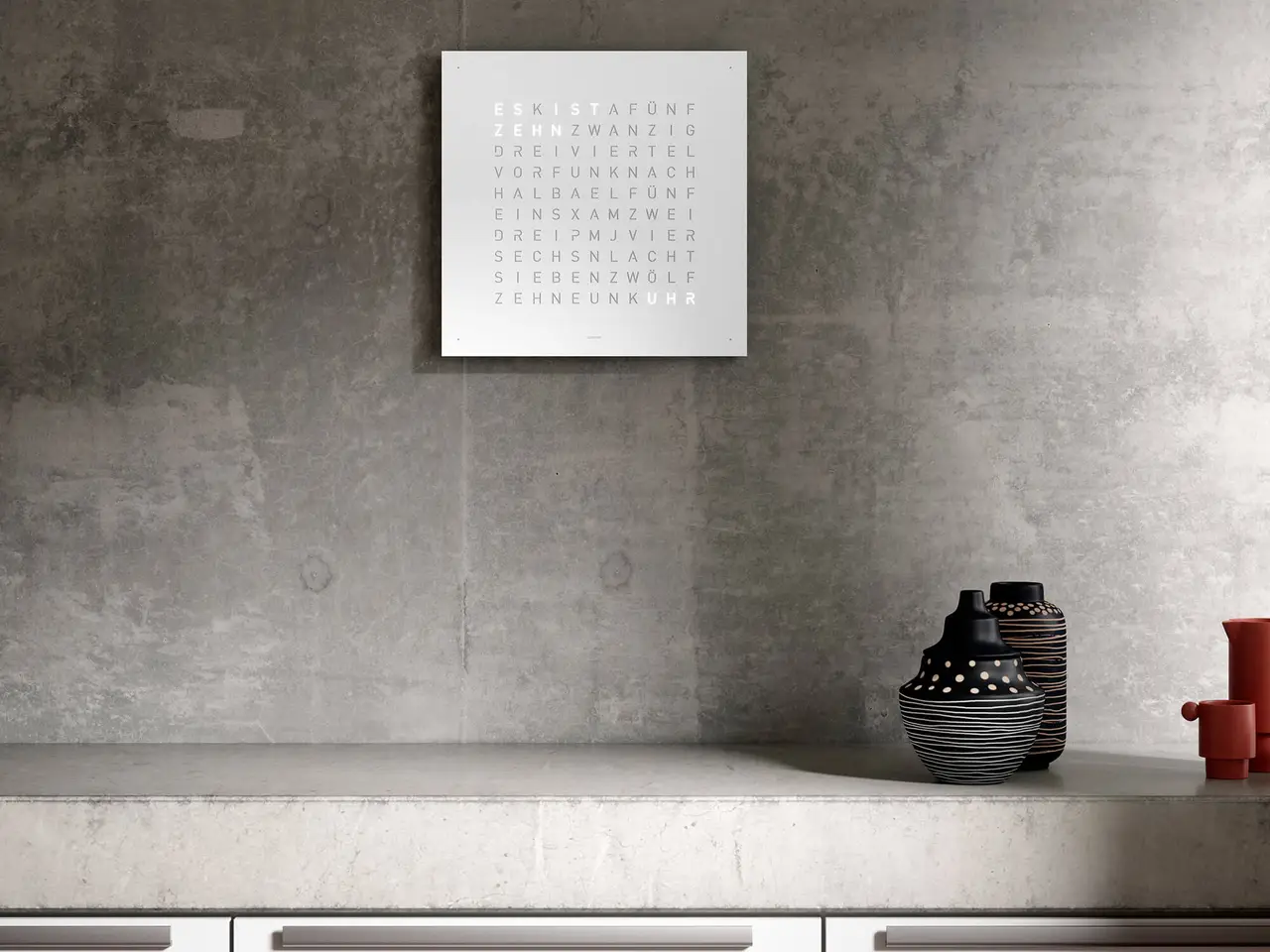 QLOCKTWO EARTH 45 White Pepper word clock with white textured surface mounted in a bright interior