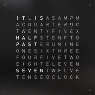 Front view of QLOCKTWO EARTH 45 Black Pepper wall clock with typographic time display