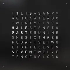 Front view of QLOCKTWO EARTH 45 Black Pepper wall clock with typographic time display