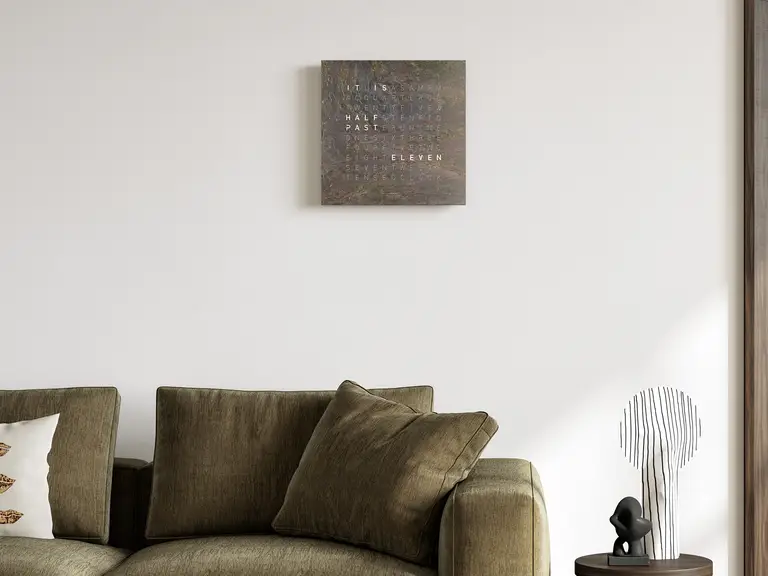 QLOCKTWO EARTH 45 Creator's Edition Glintscape word clock with shimmering sedimentary rock surface in a modern interior