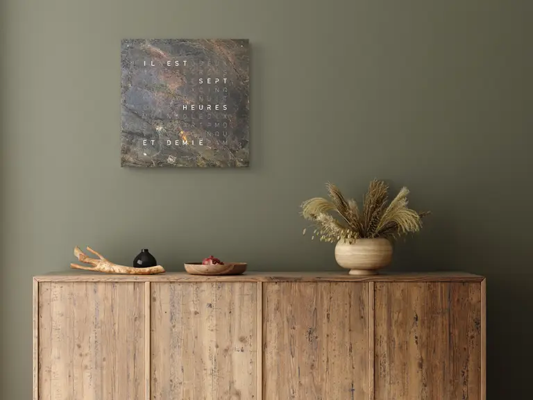 QLOCKTWO EARTH 45 Creator's Edition Glintscape word clock with shimmering sedimentary rock surface in a modern interior