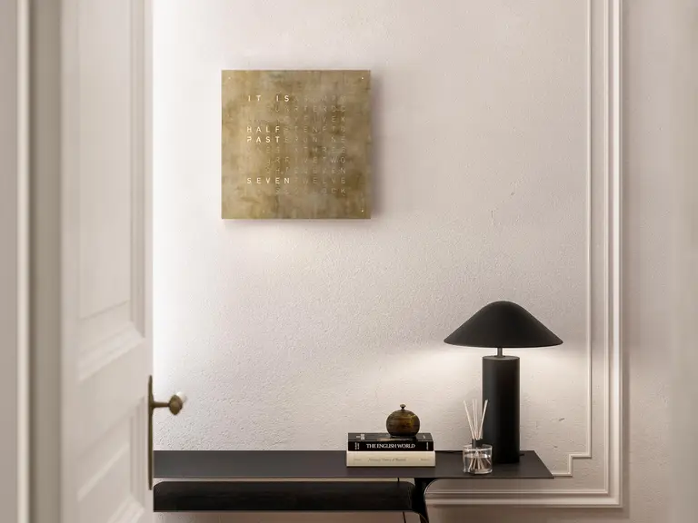 QLOCKTWO EARTH 45 Creator's Edition Silver & Gold word clock with precious metal surface in a luxury interior handcrafted with silver and gold leaf