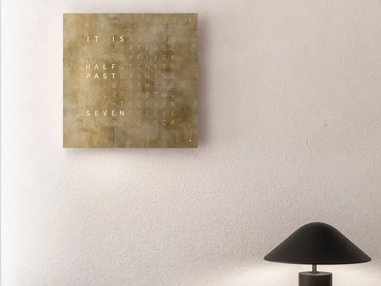 QLOCKTWO EARTH 45 Creator's Edition Silver & Gold word clock with precious metal surface in a luxury interior handcrafted with silver and gold leaf