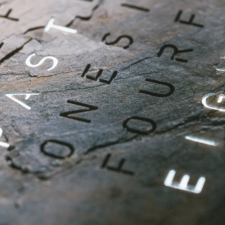 Close-up of QLOCKTWO EARTH 45 Creator's Edition Glintscape mineral sedimentary rock texture