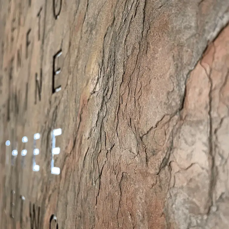 Close-up of QLOCKTWO EARTH 45 Creator's Edition Glintscape mineral sedimentary rock texture